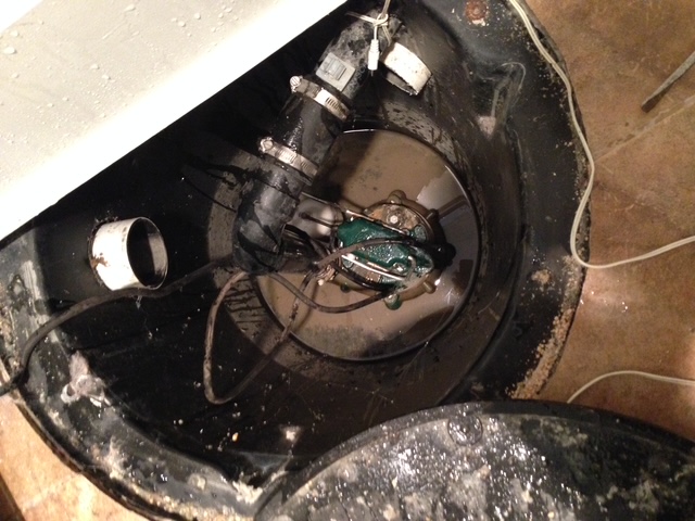 Exposed sump pump showing the need for repair