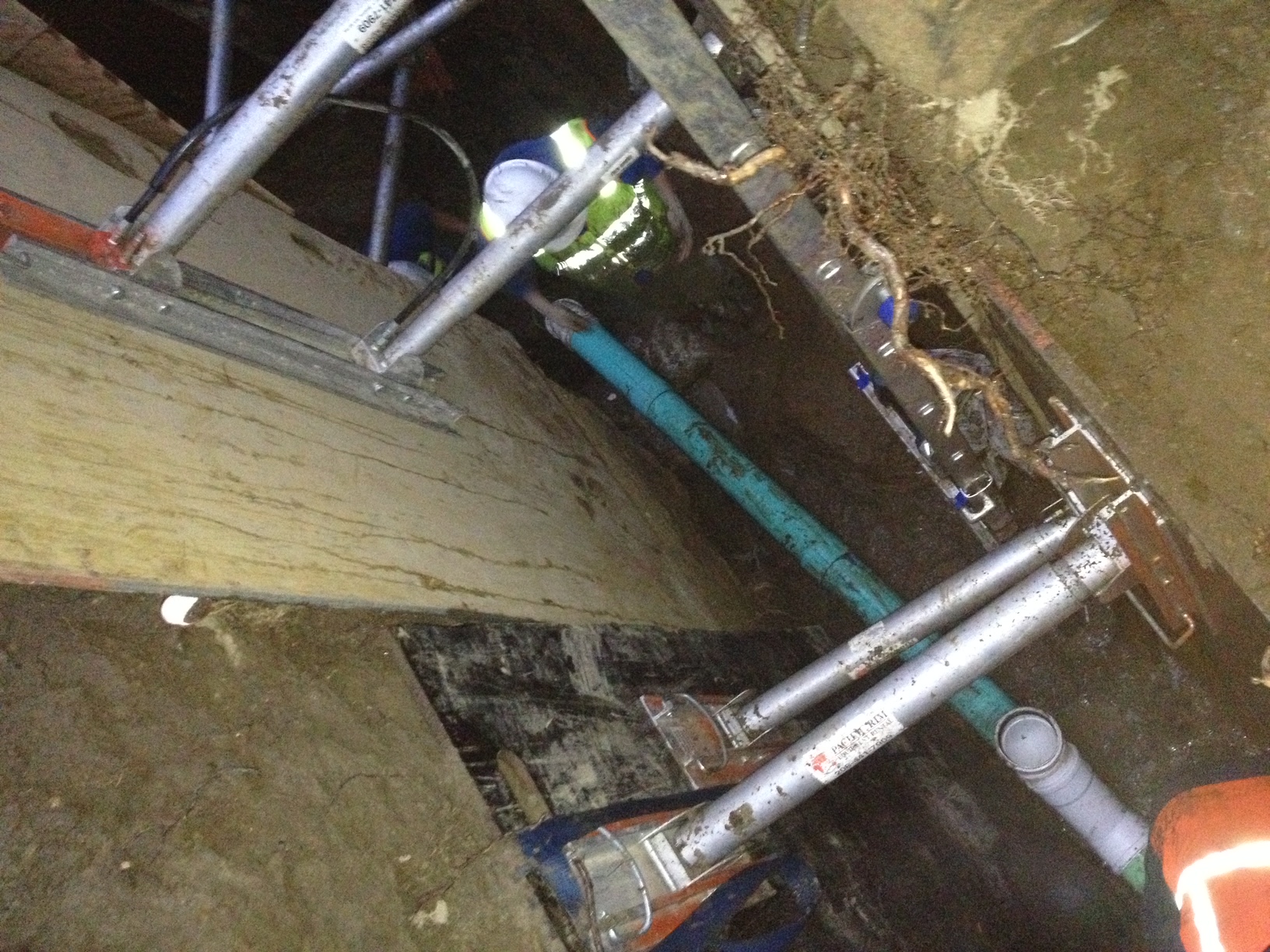 water main exposed for work, 5 pipes showing